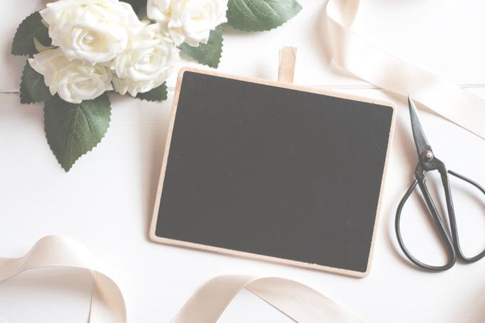 Image of a black chalkboard, scissors, and a bouquet of white flowers - 80 Creative and inspiring engagement party ideas - Image